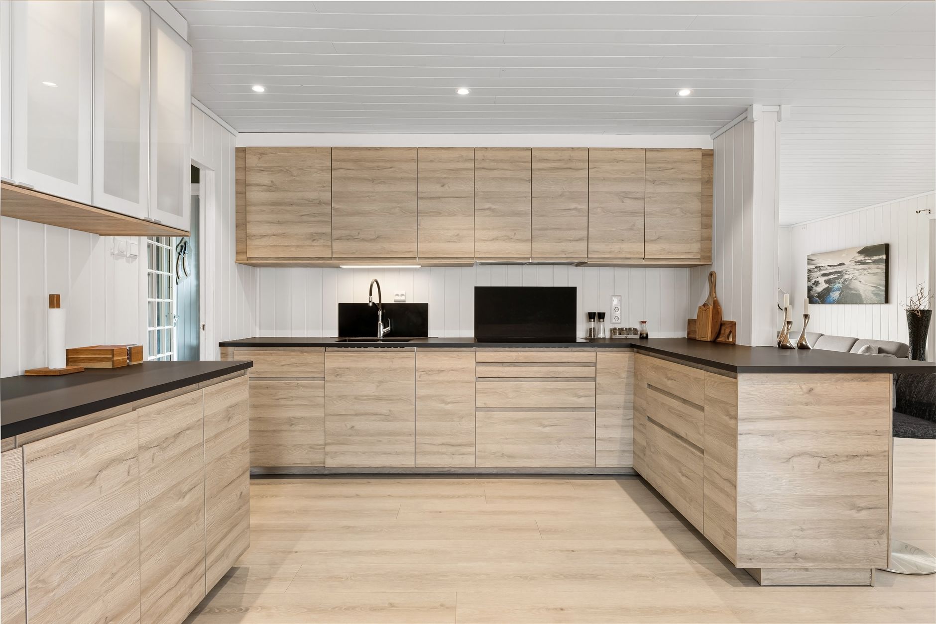 Spacious modern kitchen with wooden cabinetry and sleek design elements in Austin, TX